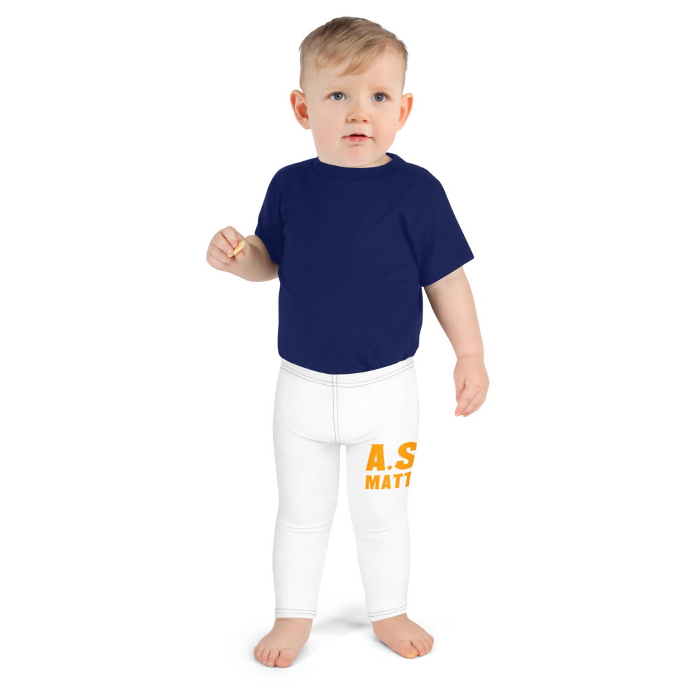 Child in a navy tee and white A.S.K. leggings