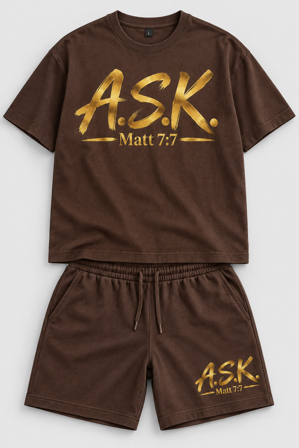 A matching brown men's two-piece set — a brown short-sleeve tee and matching brown shorts, each carrying the gold A.S.K. Matt 7:7 mark printed into the fabric
